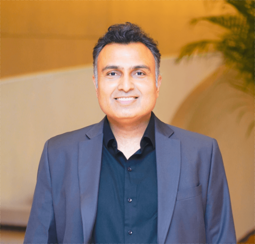Portrait of Mr. Sanjeev Jindal, CEO of Riverdale Group